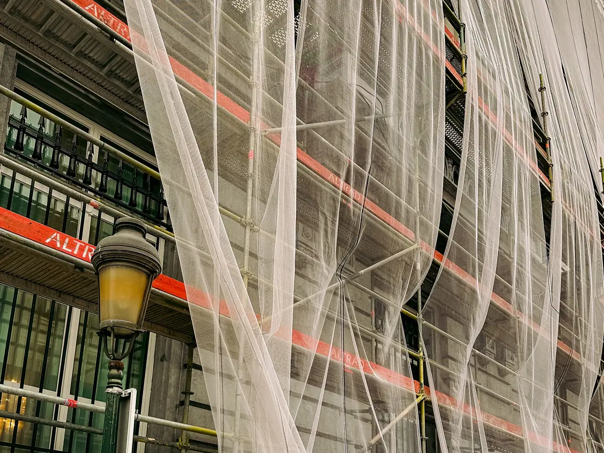 Meshed scaffold across a building front
