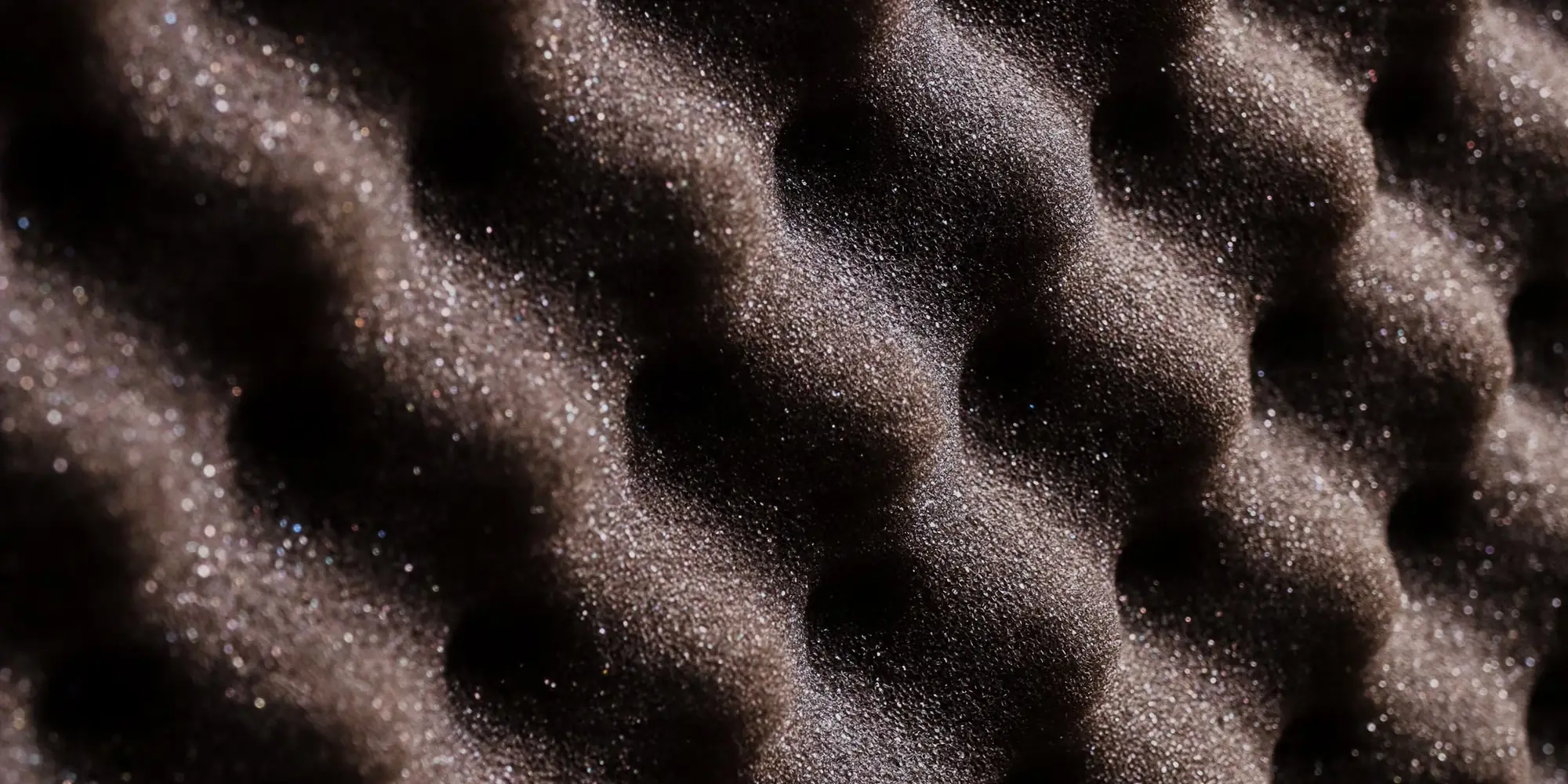 Rows of acoustic foam wedges on a wall